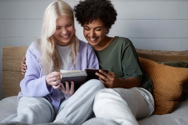 Lesbian couple looking at a photo album