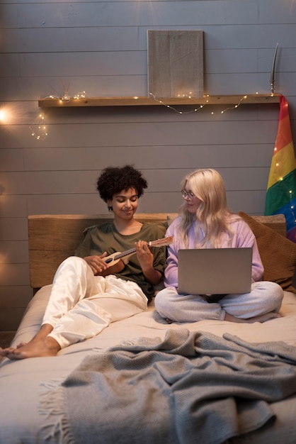 Lesbian couple looking on their laptop