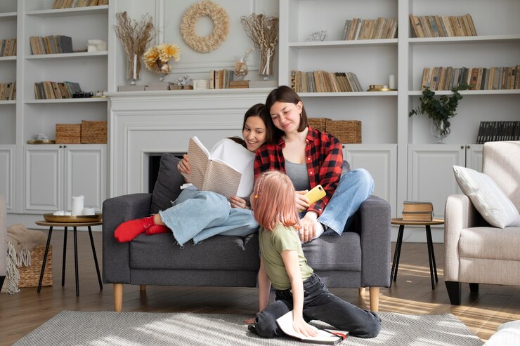 Free Photo lesbian couple spending time with their daughter