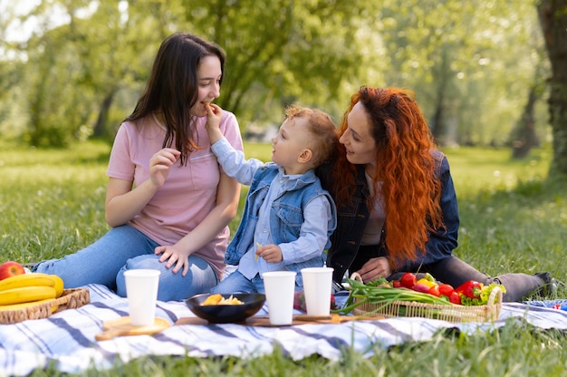 Lesbian couple spending time with their kid