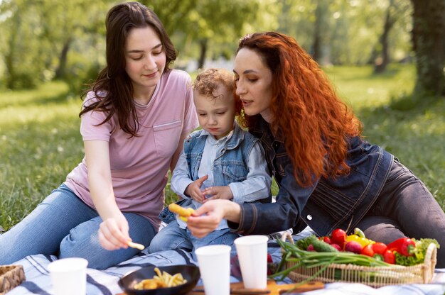 Lesbian couple spending time with their kid