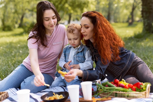 Lesbian couple spending time with their kid