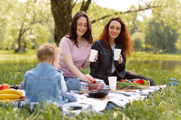 Lesbian couple spending time with their kid