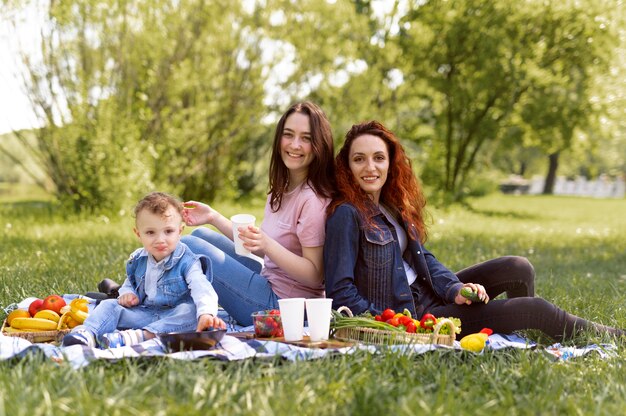 Lesbian couple spending time with their kid