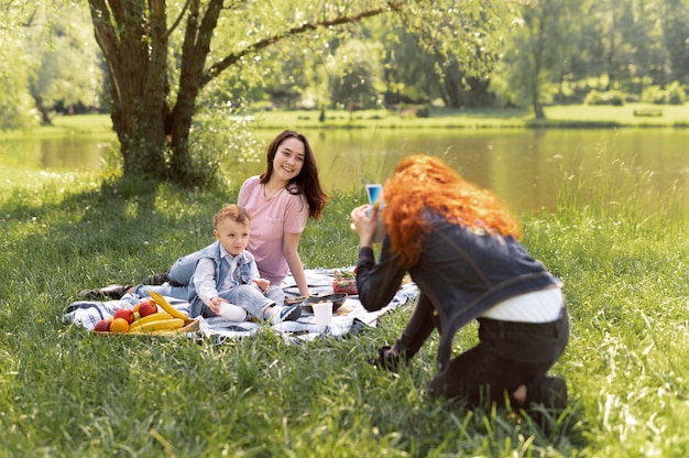 Free photo lesbian couple spending time with their kid