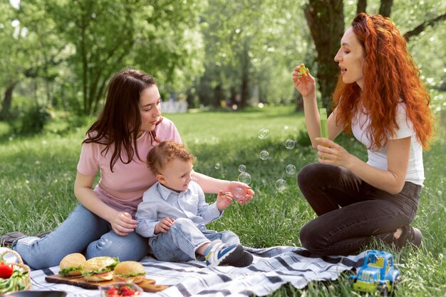 Lesbian couple spending time with their kid