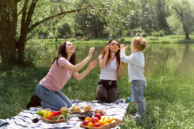 Lesbian couple spending time with their kid