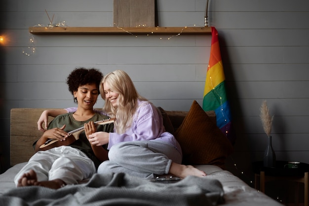 Lesbian couple with rainbow flag