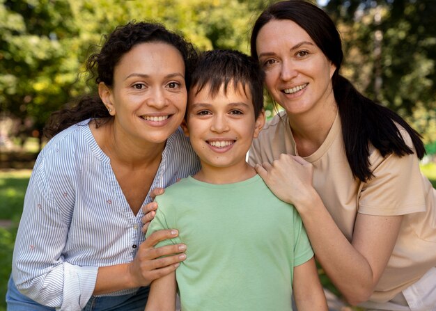 Lesbian couple with their son spending time together outdoors