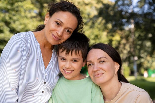 Lesbian couple with their son spending time together outdoors