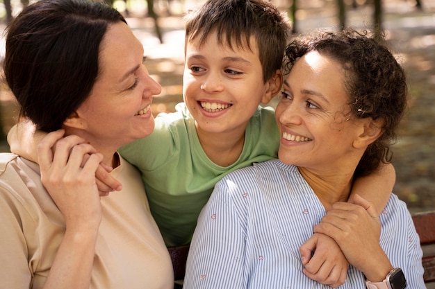 Lesbian couple with their son spending time together outdoors