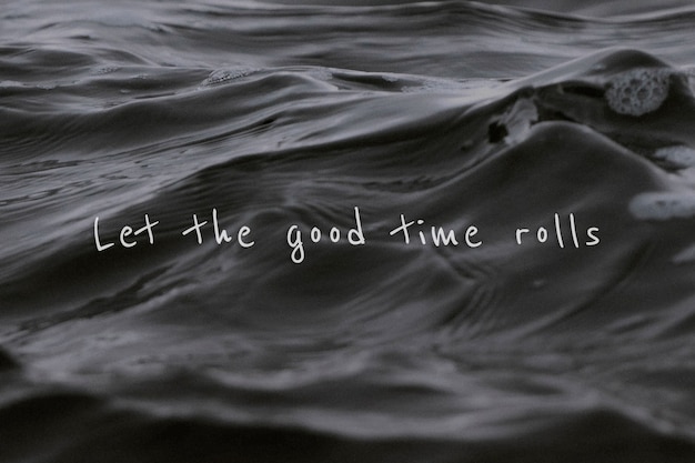 Free photo let the good time rolls quote on a water wave background