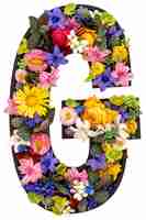 Free photo letter g made of real natural flowers and leaves on white background isolated