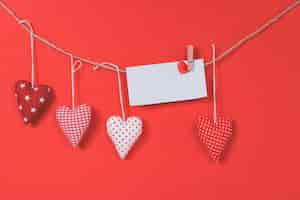 Free photo letter hanging on a rope with hearts