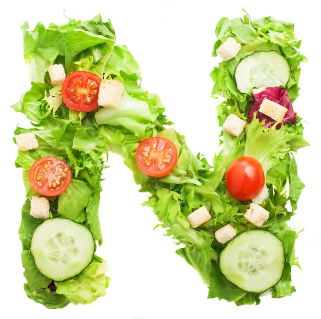 Free photo letter n with slice of cucumber and lettuce