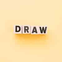 Free photo letters on cubes forming the word draw