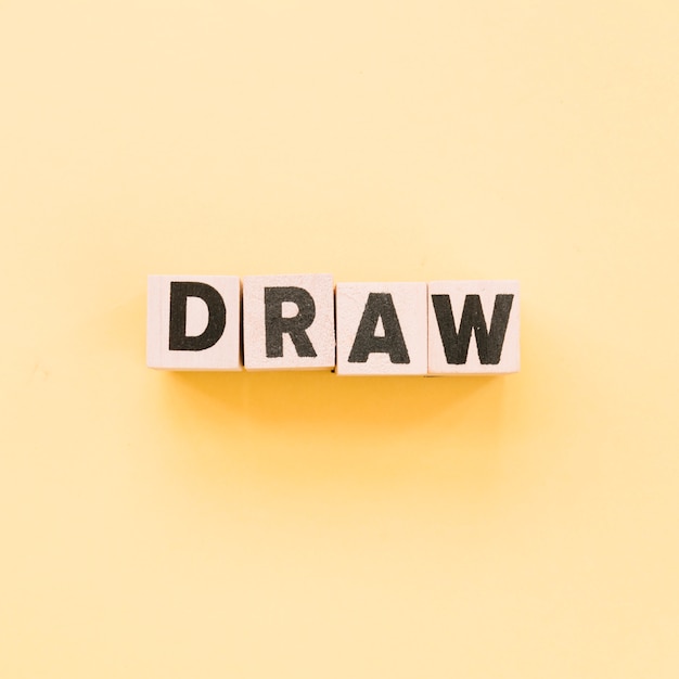 Letters on cubes forming the word draw