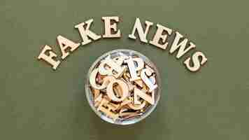 Free photo letters forming fake news message