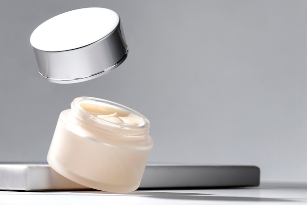 Free photo levitating cosmetic cream display