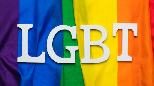 LGBT lettering on rainbow flag