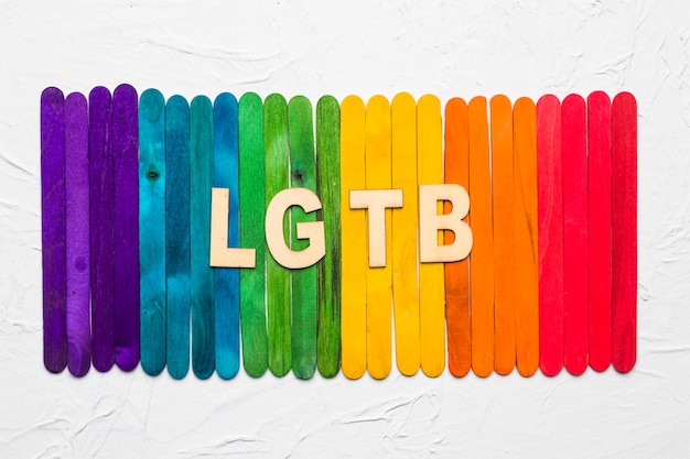 LGBT letters on background of colorful wooden sticks