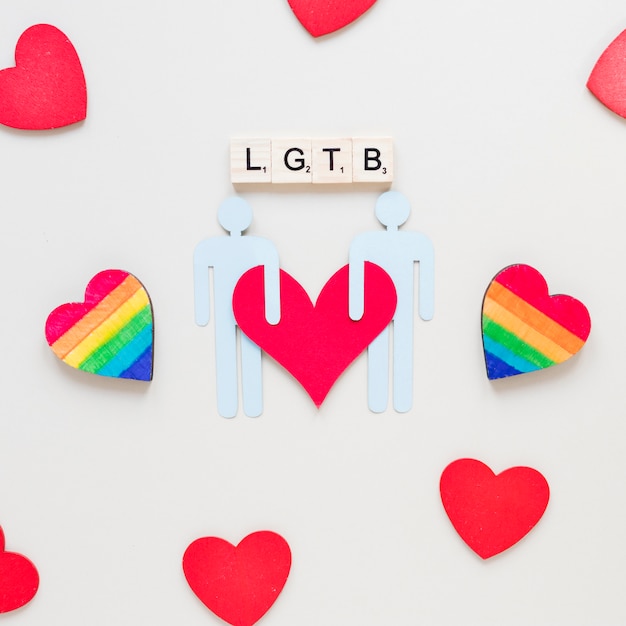 LGTB inscription with rainbow hearts and gay couple icon