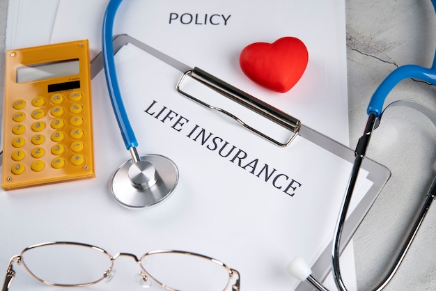 Free Photo life insurance concept with paper