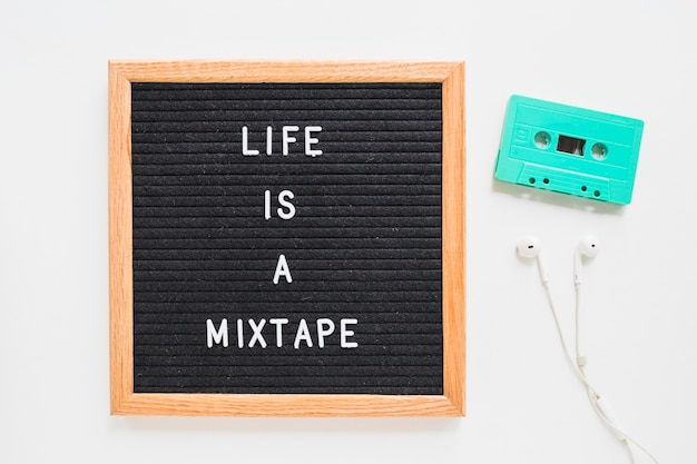 Free photo life is a mixtape lettering on board