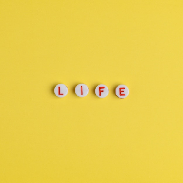 LIFE, word with beads