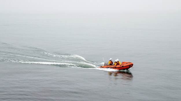 Lifeguard boat with three lifeguar