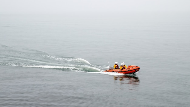 Lifeguard boat with three lifeguar