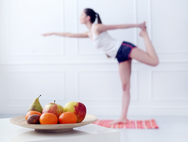 Free photo lifestyle. beautiful girl during yoga exercise