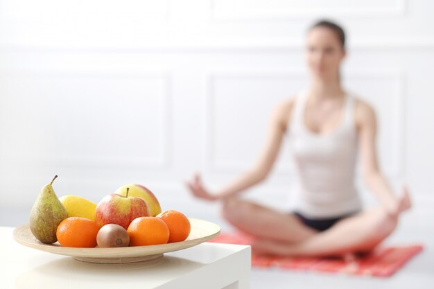 Lifestyle. Beautiful girl during yoga exercise