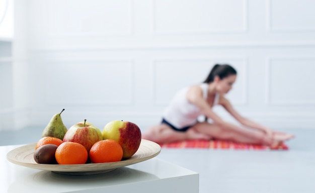 Lifestyle. Beautiful girl during yoga exercise