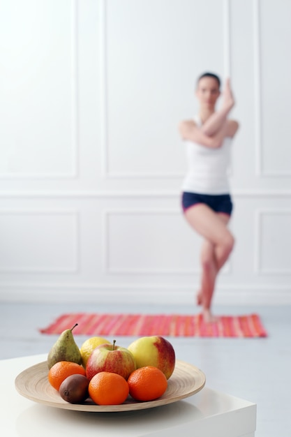 Lifestyle. Beautiful girl during yoga exercise