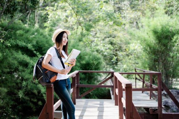 Lifestyle beautiful woman happy torist to travel in wild trip hiking during vacation.