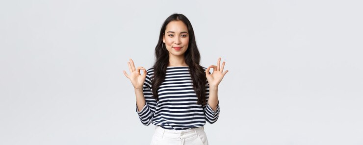 Free Photo lifestyle beauty and fashion people emotions concept satisfied goodlooking female guarantee quality of product recommend advertisement showing okay sign say no problem have all under control