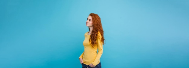 Lifestyle concept close up portrait young beautiful attractive ginger red hair girl playing with her