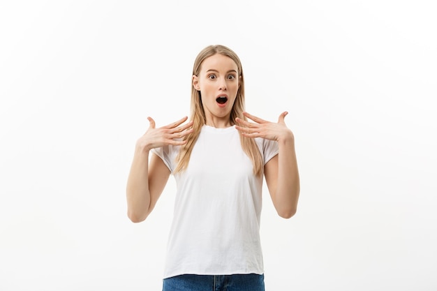 Lifestyle Concept: Portrait of a scared frightened girl standing and surprising facial expression isolated over white background.