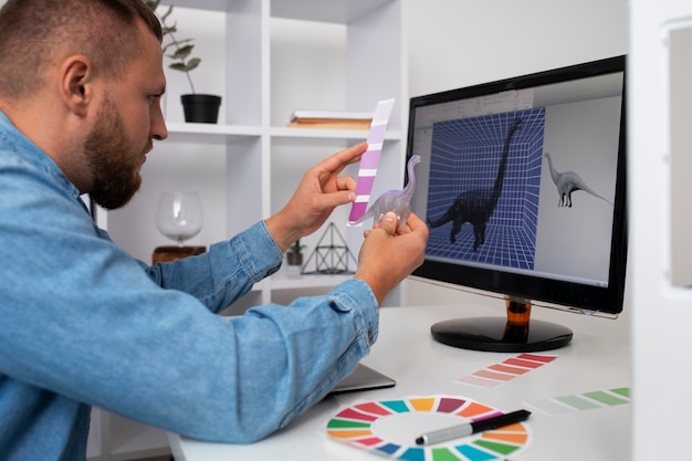 Foto gratuita stile di vita del designer che usa una stampante 3d