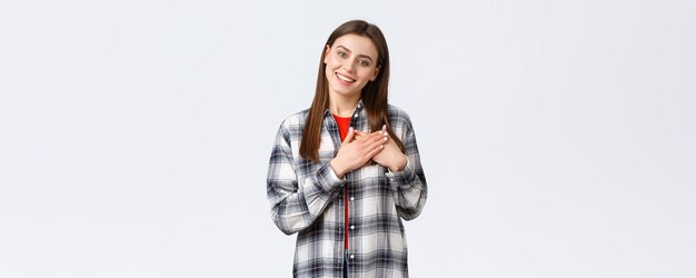 Lifestyle different emotions leisure activities concept touched tender young woman in checked shirt