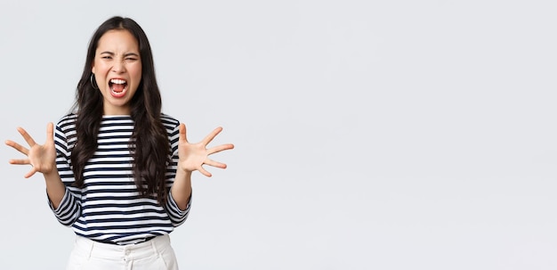 Free photo lifestyle people emotions and casual concept mad distressed asian woman losing temper cant stand it anymore release anger complaining shouting as having argument shaking hands aggressive