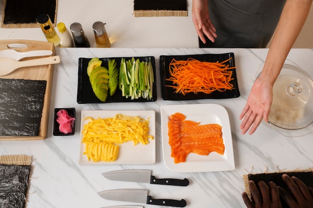 Free photo lifestyle: people learning to make sushi