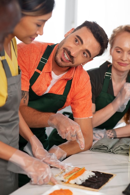 Free photo lifestyle: people learning to make sushi