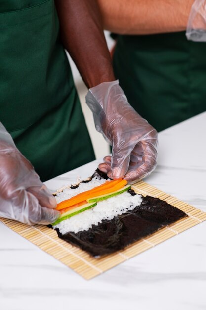 Lifestyle: people learning to make sushi