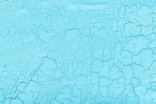 Light blue lime plaster with cracks background