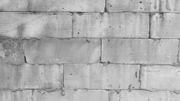 Free photo light brick with cement on the wall