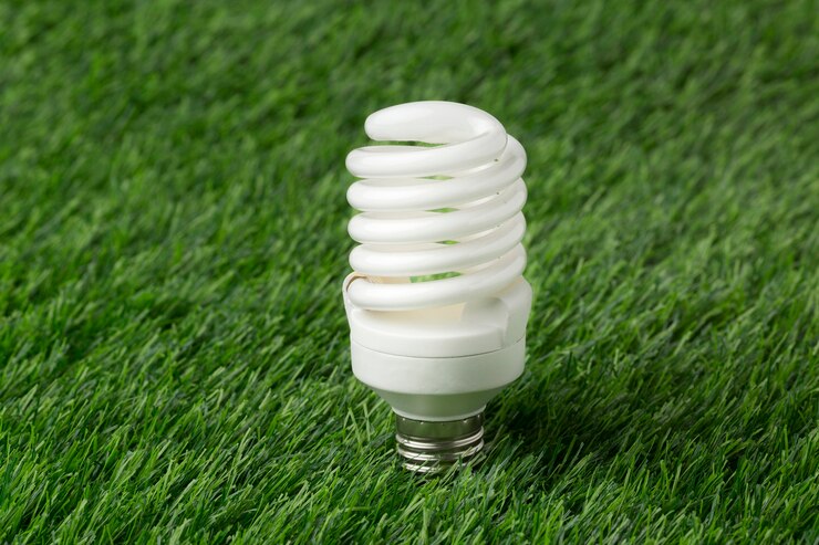 Free Photo light bulb on grass