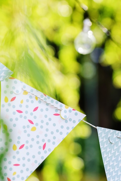 Light bulbs and garland hang on branches