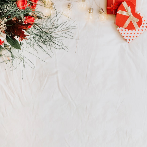 Light garland between presents and bouquet